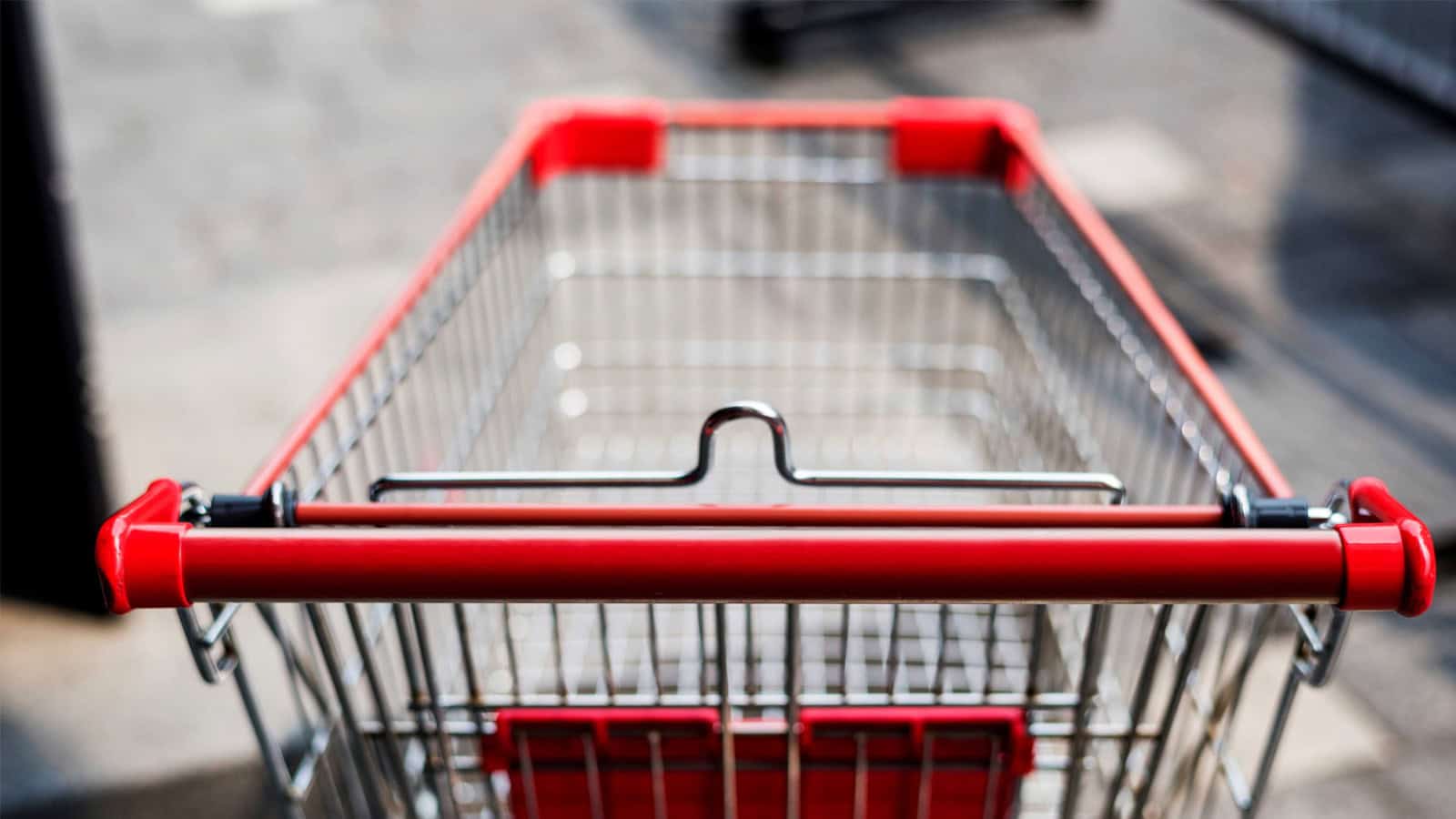 Empty shopping cart left outside a store