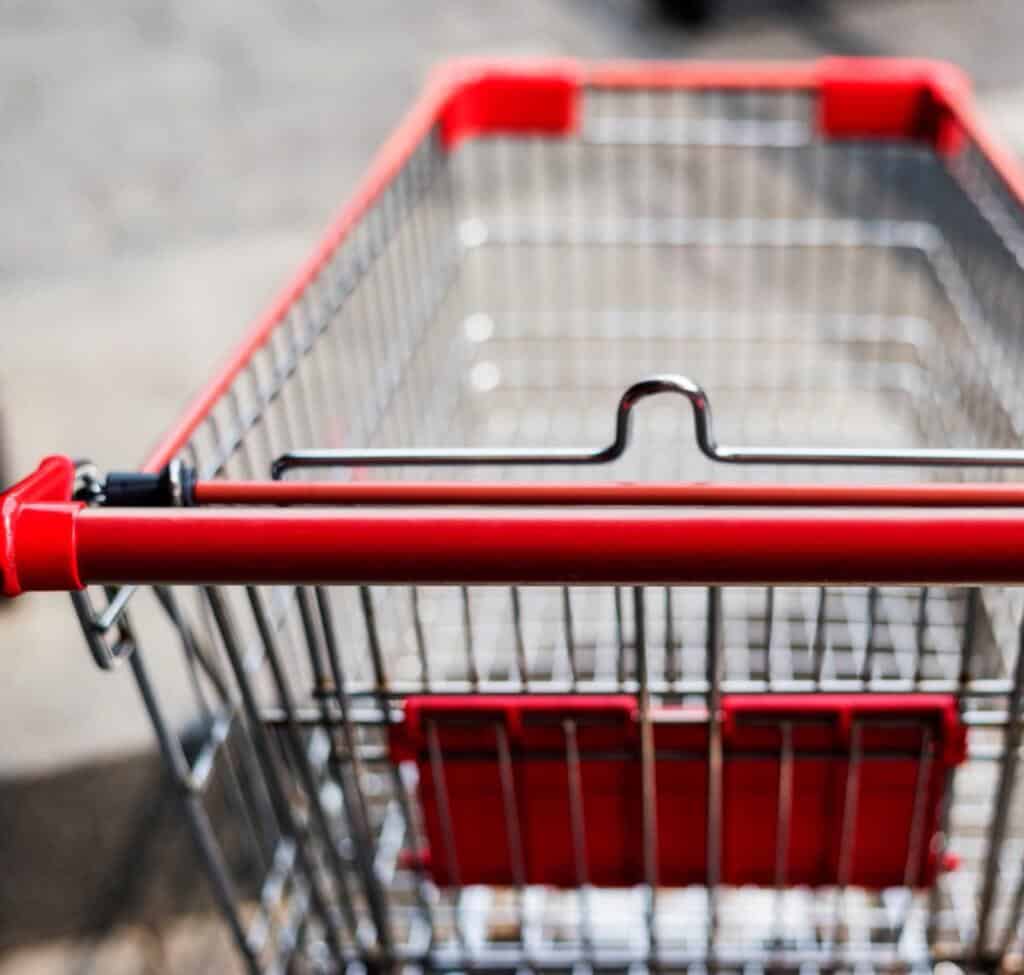 Empty shopping cart left outside a store