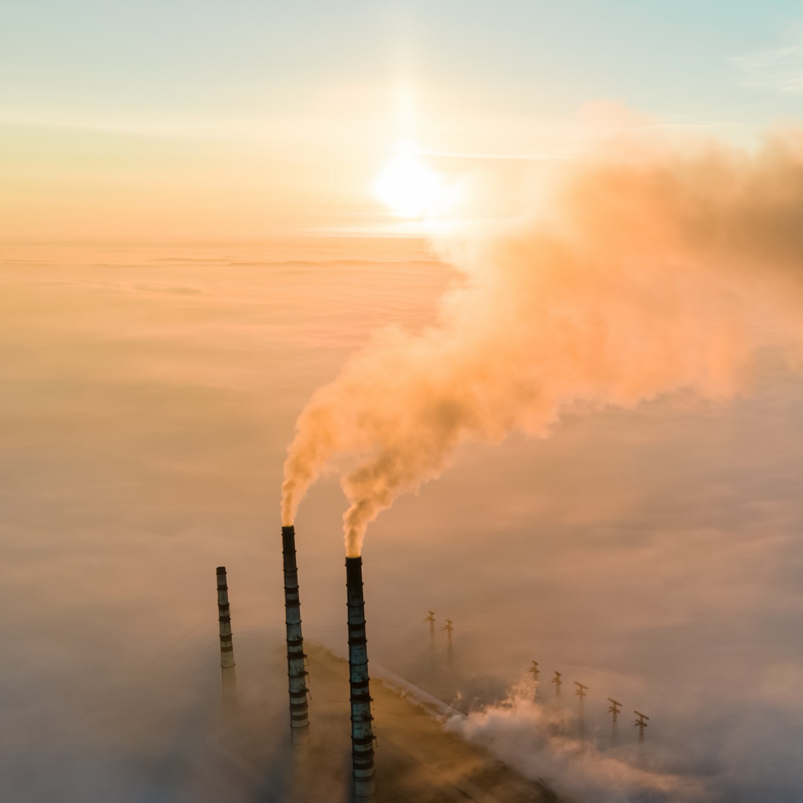 Industrial power plant with smokestacks