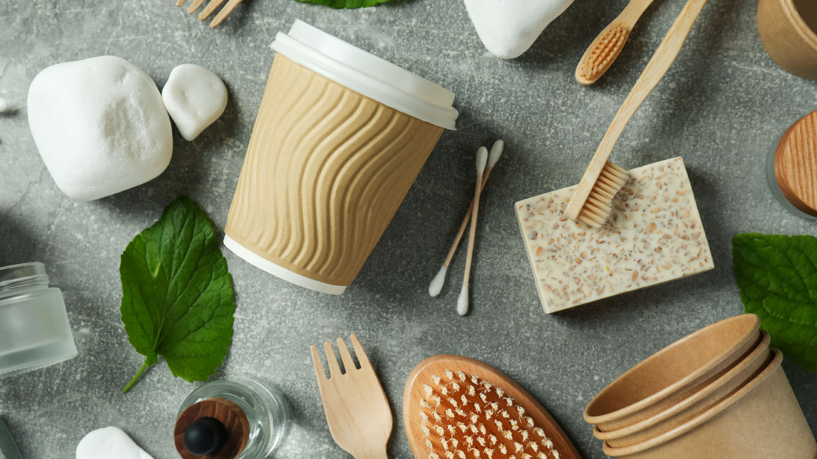 Reusable, zero waste household products on a gray background